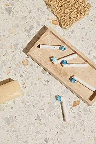 A small, white Jordan Clean Smile whitening brush head effectively removes plaque and stains, offering thorough and gentle cleaning for compatible electric toothbrushes.