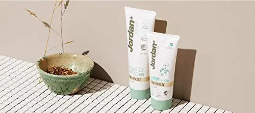 A tube of Jordan Green Clean cavity protection toothpaste, a vegan dental care product with 98% natural ingredients and recycled packaging.