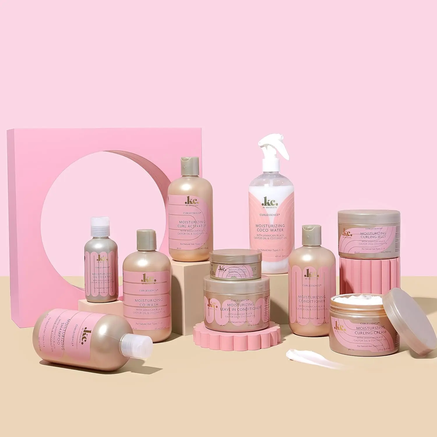 KeraCare COCO Water in a clear bottle with a white sprayer, designed to re-wet, moisturize, define curls, prevent frizz and add shine to hair.