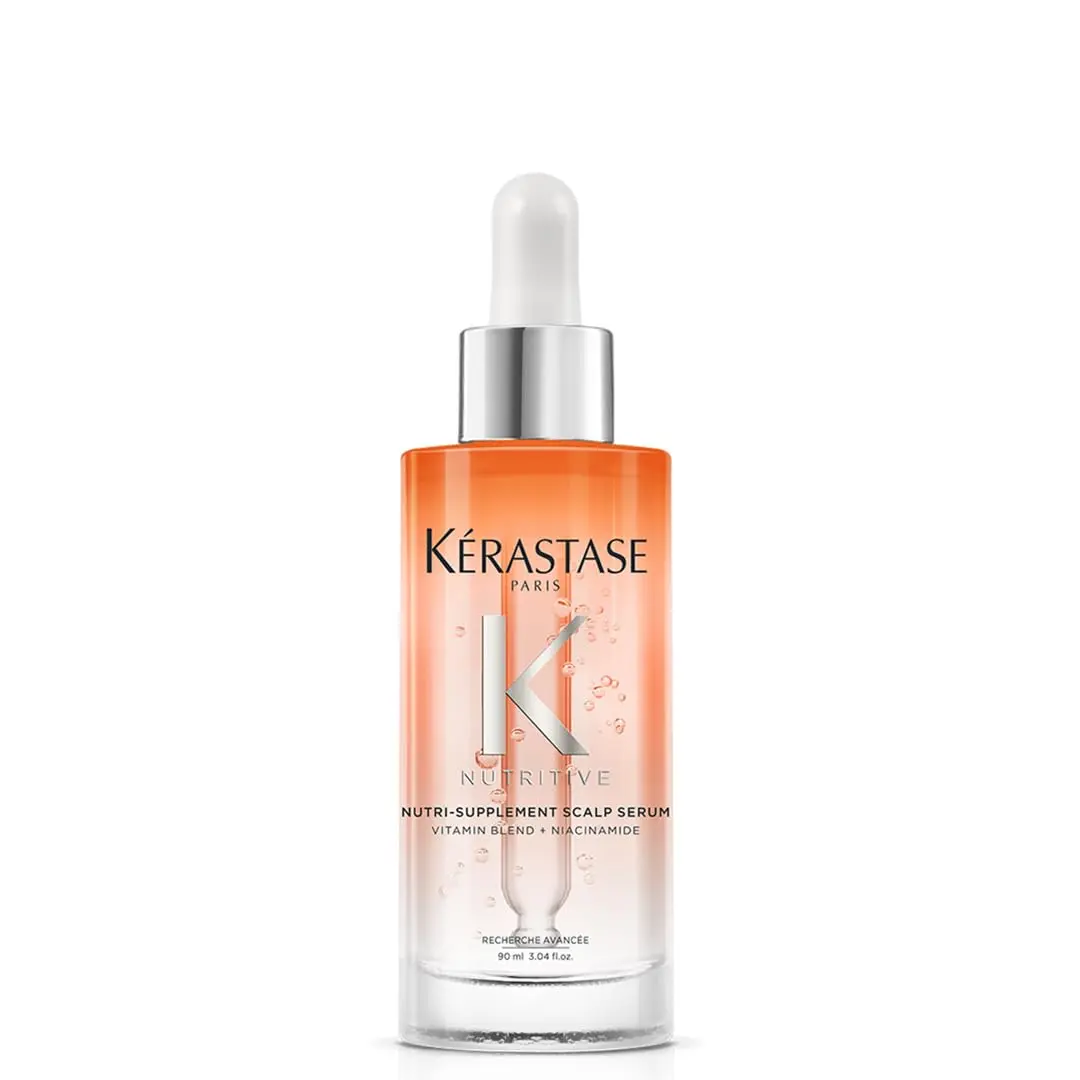 Kérastase Nutritive hair serum providing instant hydration for dry scalp and dry hair, loaded with essential vitamins and quickly absorbing into the hair.