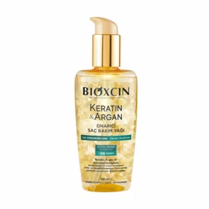 Bottle of Bioxcin hair oil with keratin and argan, designed to repair worn and damaged hair.