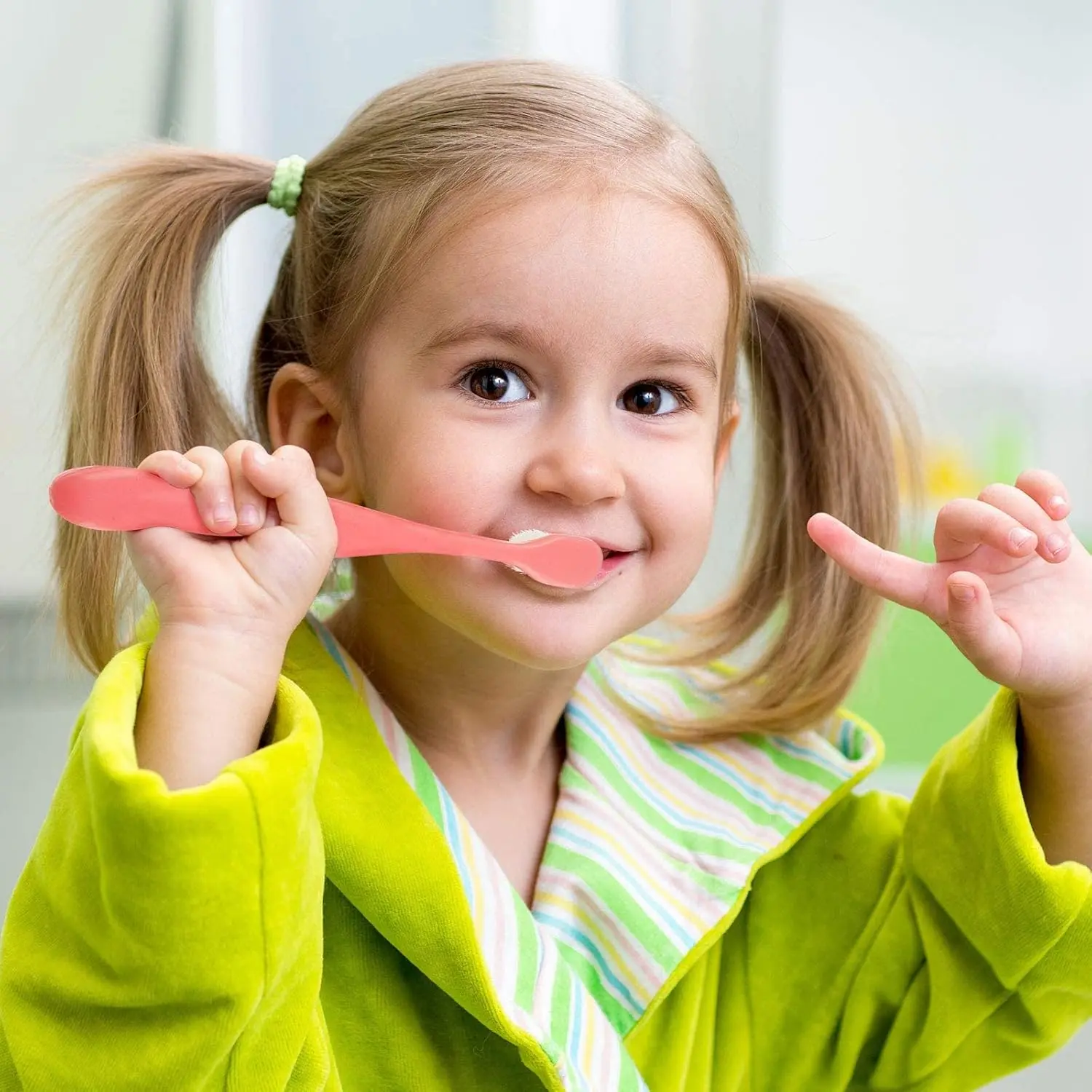 Four extra soft nano toothbrushes in blue and pink colors designed for toddlers and children for gentle and effective teeth cleaning.