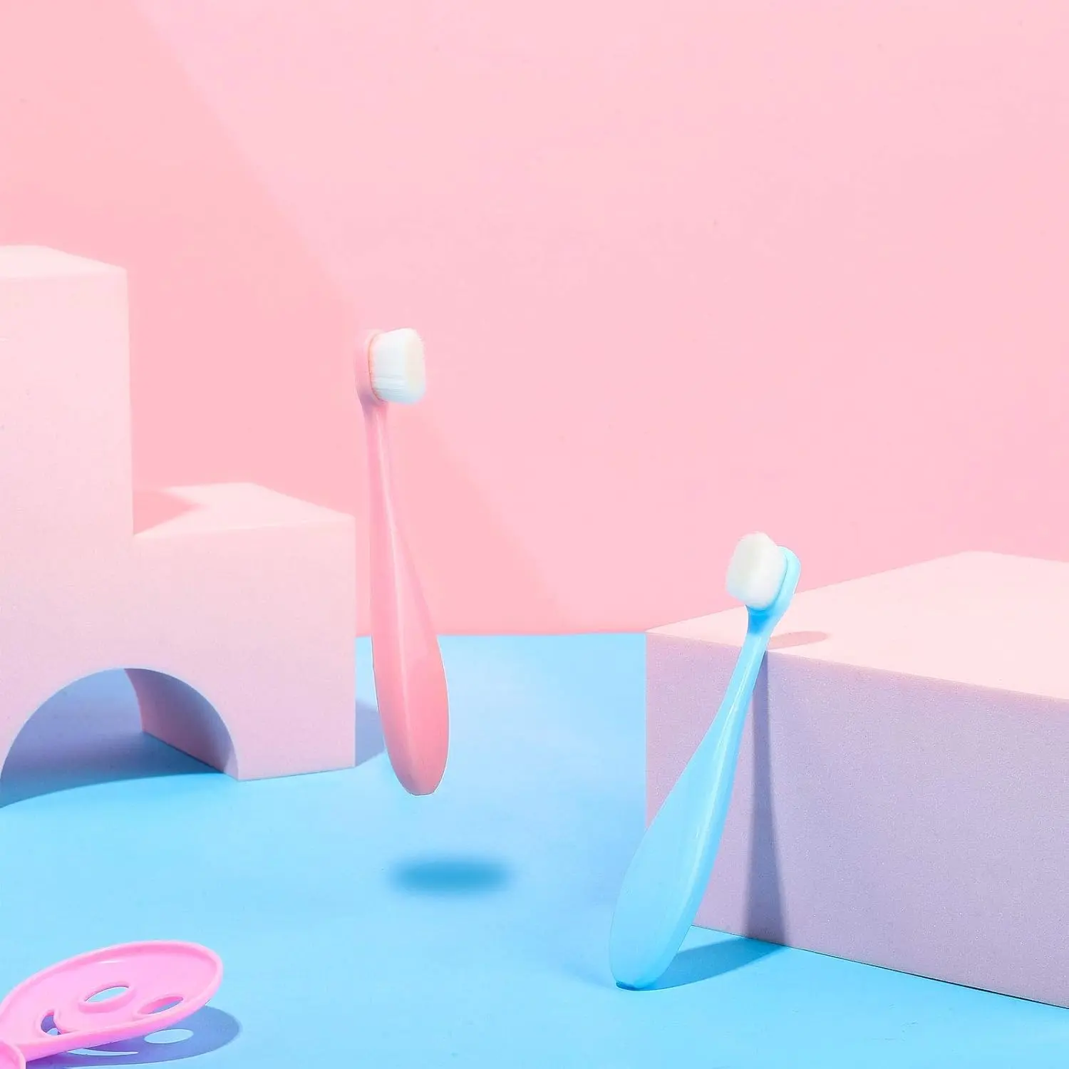 Four extra soft nano toothbrushes in blue and pink colors designed for toddlers and children for gentle and effective teeth cleaning.