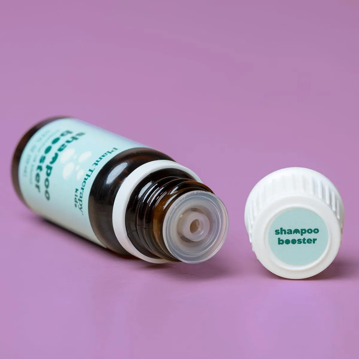 Plant Therapy KidSafe hair therapy essential oil blend naturally cleanses buildup and soothes irritated scalps, while softening and strengthening children's hair.