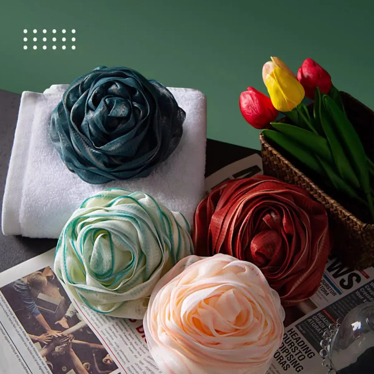 A four-pack of large, rose-shaped bath sponges designed to exfoliate and cleanse skin, creating a rich lather with shower gel or soap.