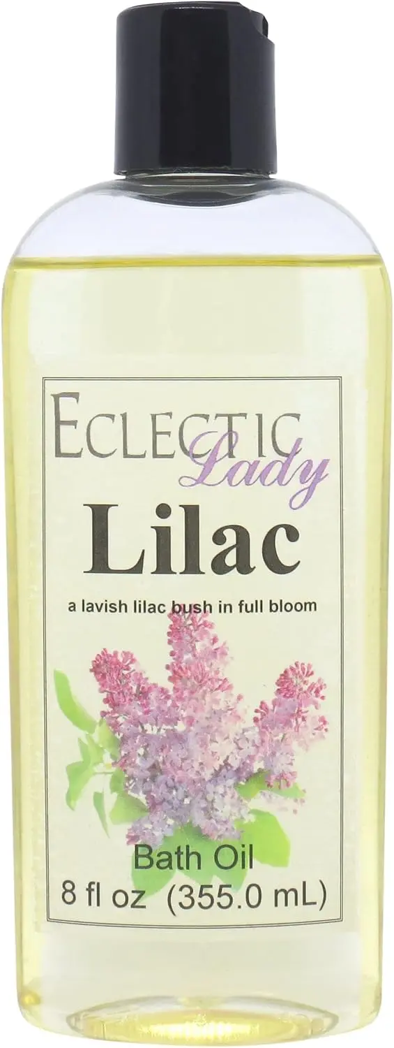A bottle of handmade lilac bath oil infused with sweet almond and organic jojoba oil sits ready to create a captivating and fragrant bath experience.