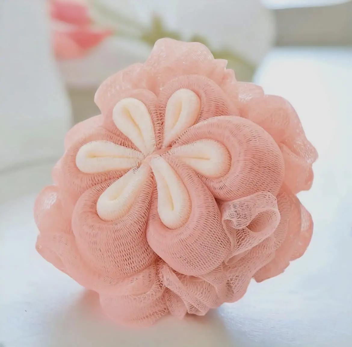 This is a 3 pack of MOMENT loofah bath sponges designed for exfoliating and cleansing the body, featuring soft mesh and long handles for easy use in the shower.