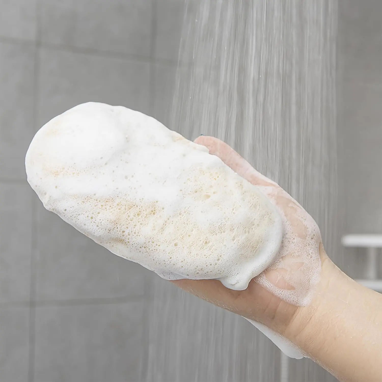 Two natural loofah sponges for women provide exfoliating body cleaning in the shower.