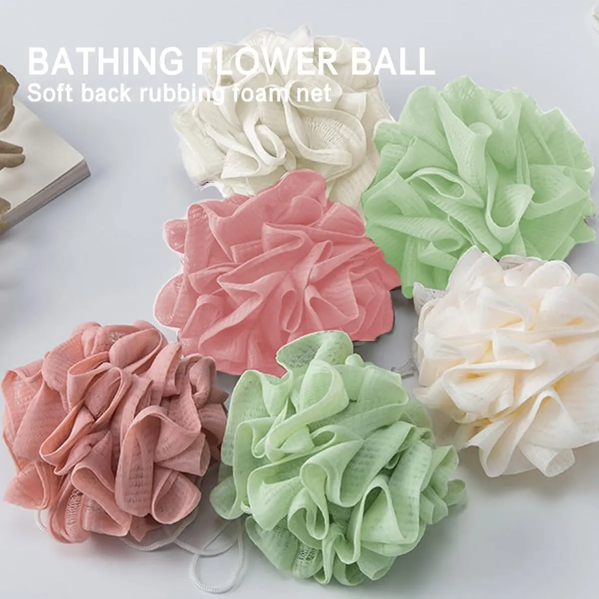 A green loofah washcloth and mesh shower ball are designed for exfoliating and cleansing with bar soap or body wash for smooth skin.