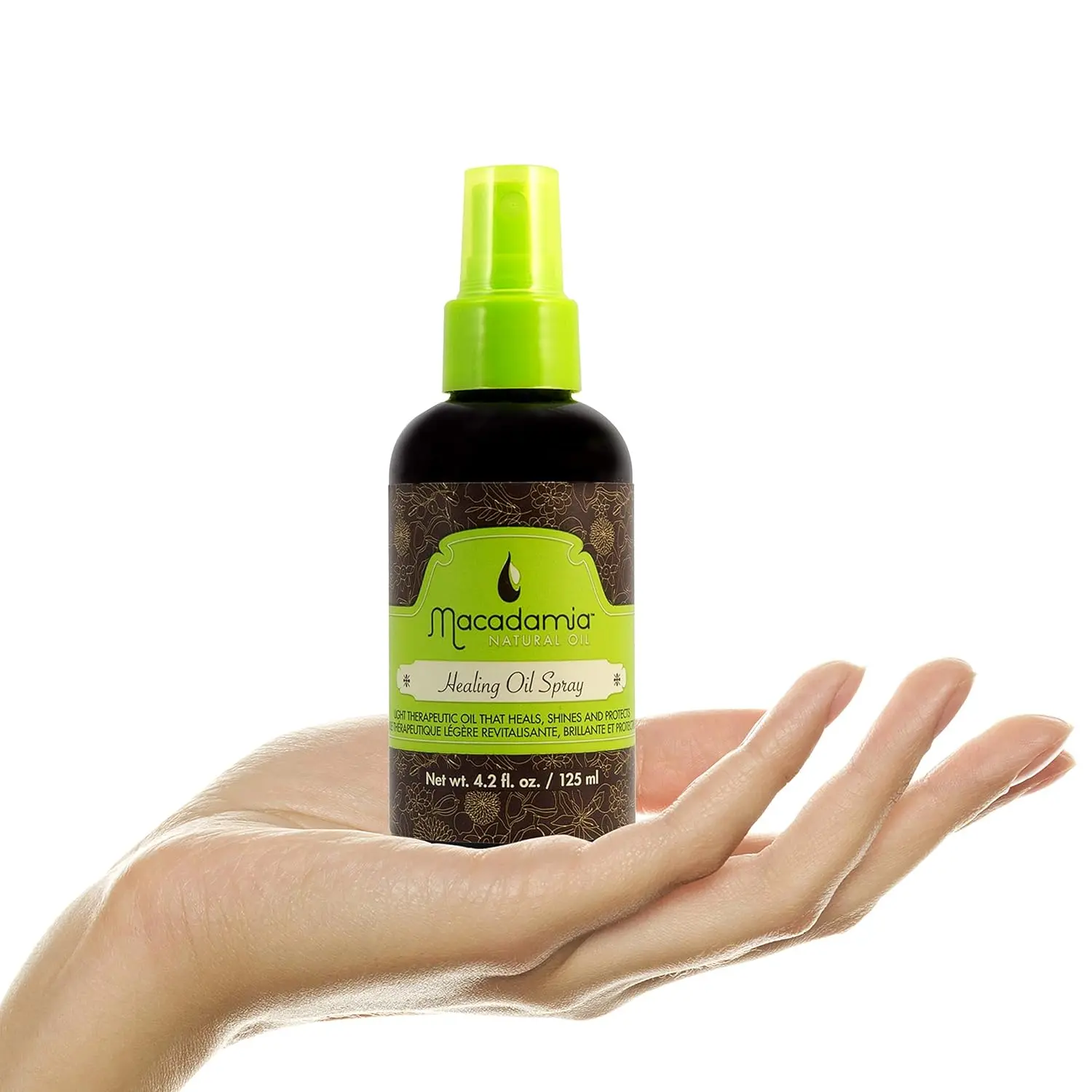 A white bottle of Macadamia Healing Oil Spray designed to instantly hydrate, nourish, and replenish moisture for tangle and frizz-free hair after swimming.