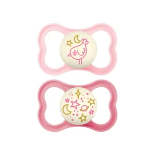This image shows a two-pack of MAM Supreme Night pacifiers for girls, sized for babies 6-16 months, featuring a glow-in-the-dark button, SkinSoft silicone nipple, and a ventilated shield designed for sensitive skin.