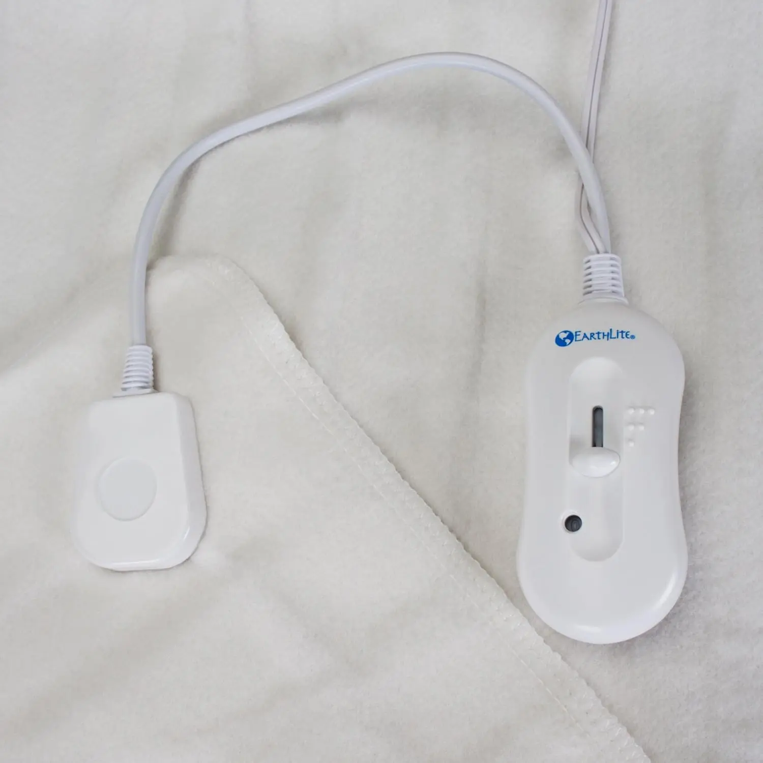 EARTHLITE massage table warmer with three heat settings and cozy felt lining, designed to fit full-sized massage tables, providing warmth and comfort.