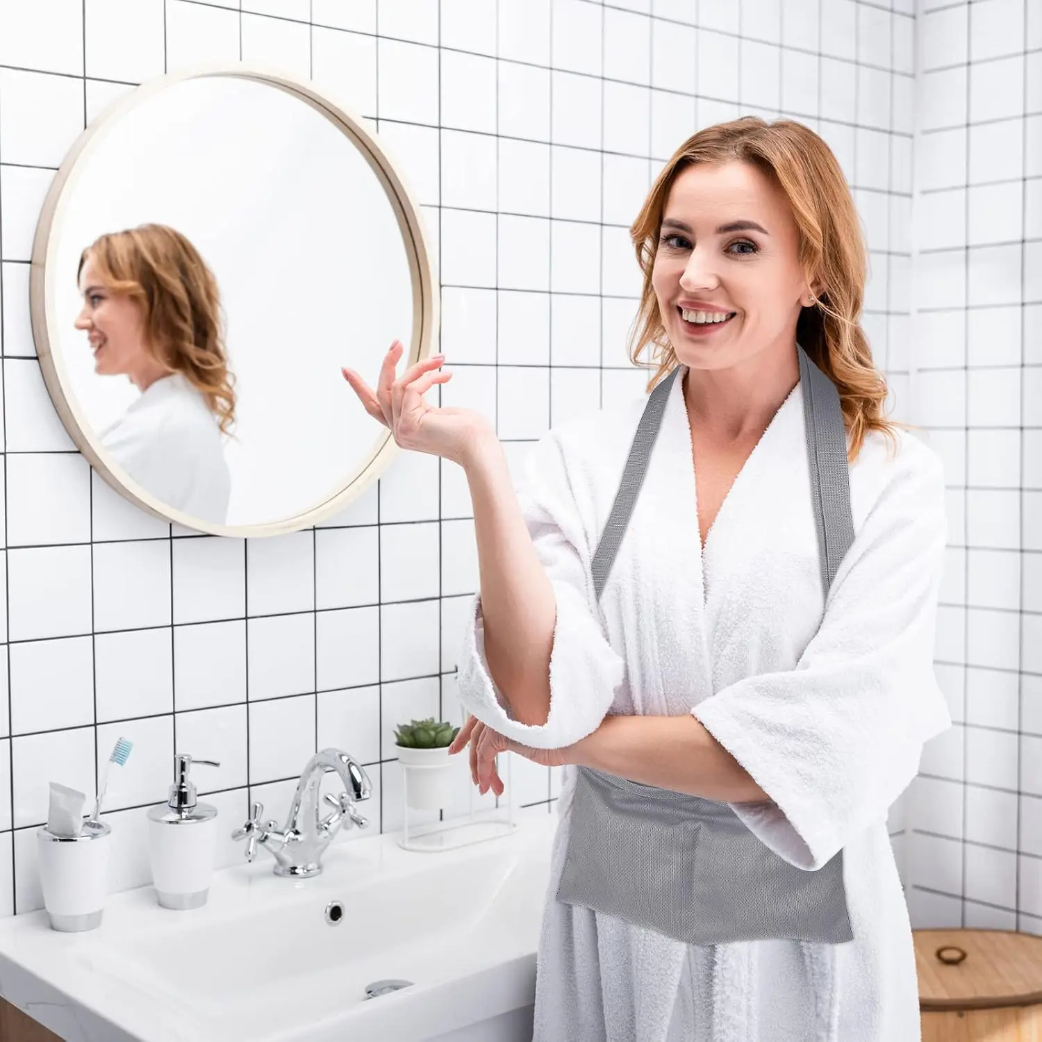 Gray mastectomy drain pouch with adjustable waist belt and shower bag provides comfortable and convenient support for post-surgery recovery and holds drain bottles securely.