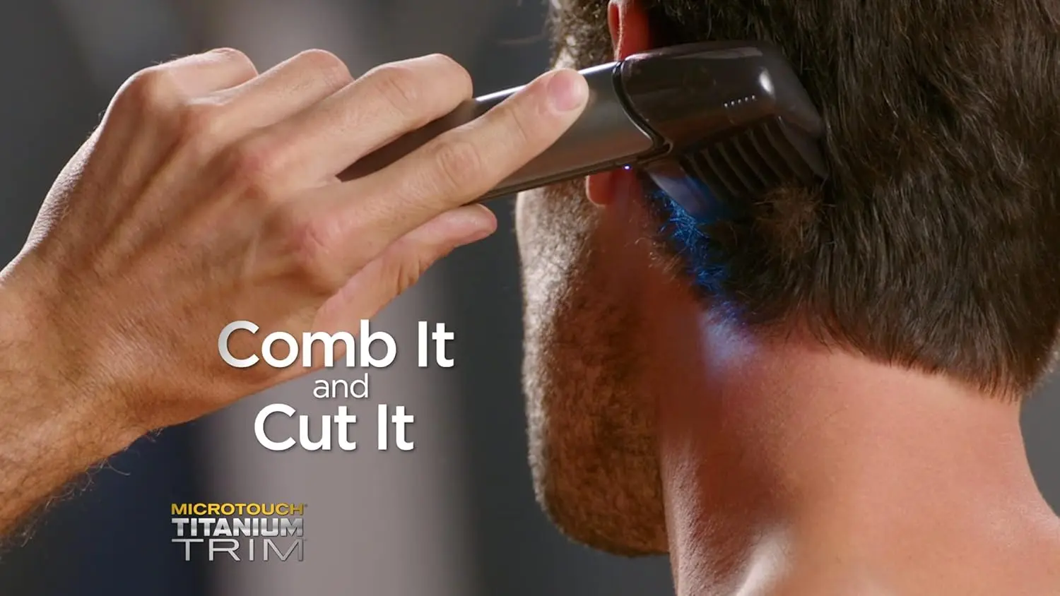 The Micro Touch Titanium Trim PRO is a rechargeable hair cutting tool and body groomer with an extendable arm, perfect for trimming hair, beards, and hard-to-reach areas like the back and shoulders.