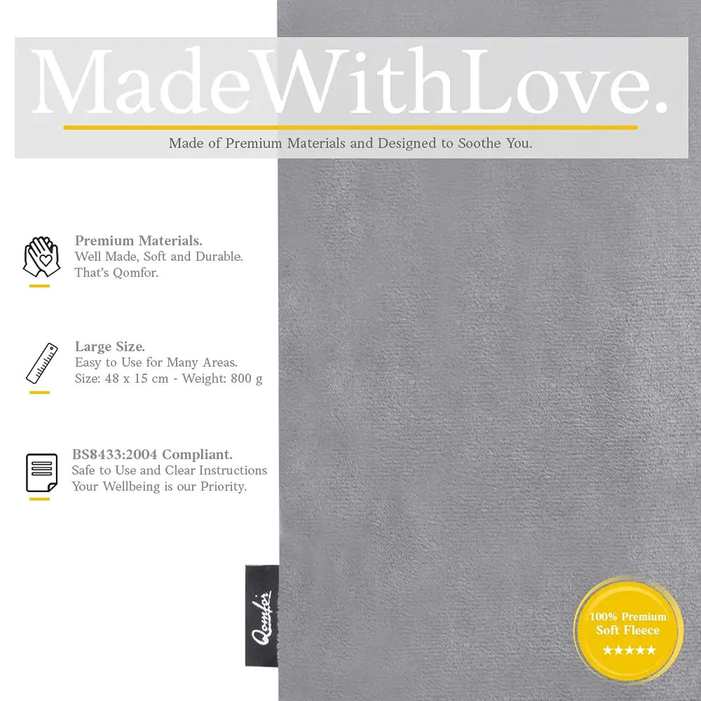 Dark grey Qomfor microwave heating pad filled with wheat and lavender providing soothing pain relief for neck, shoulders, and back.