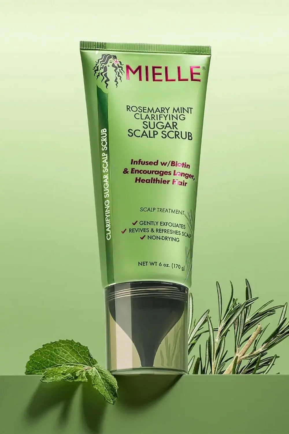 Mielle Rosemary Mint scalp scrub pre-shampoo treatment exfoliates to remove buildup and oil, leaving the scalp refreshed.