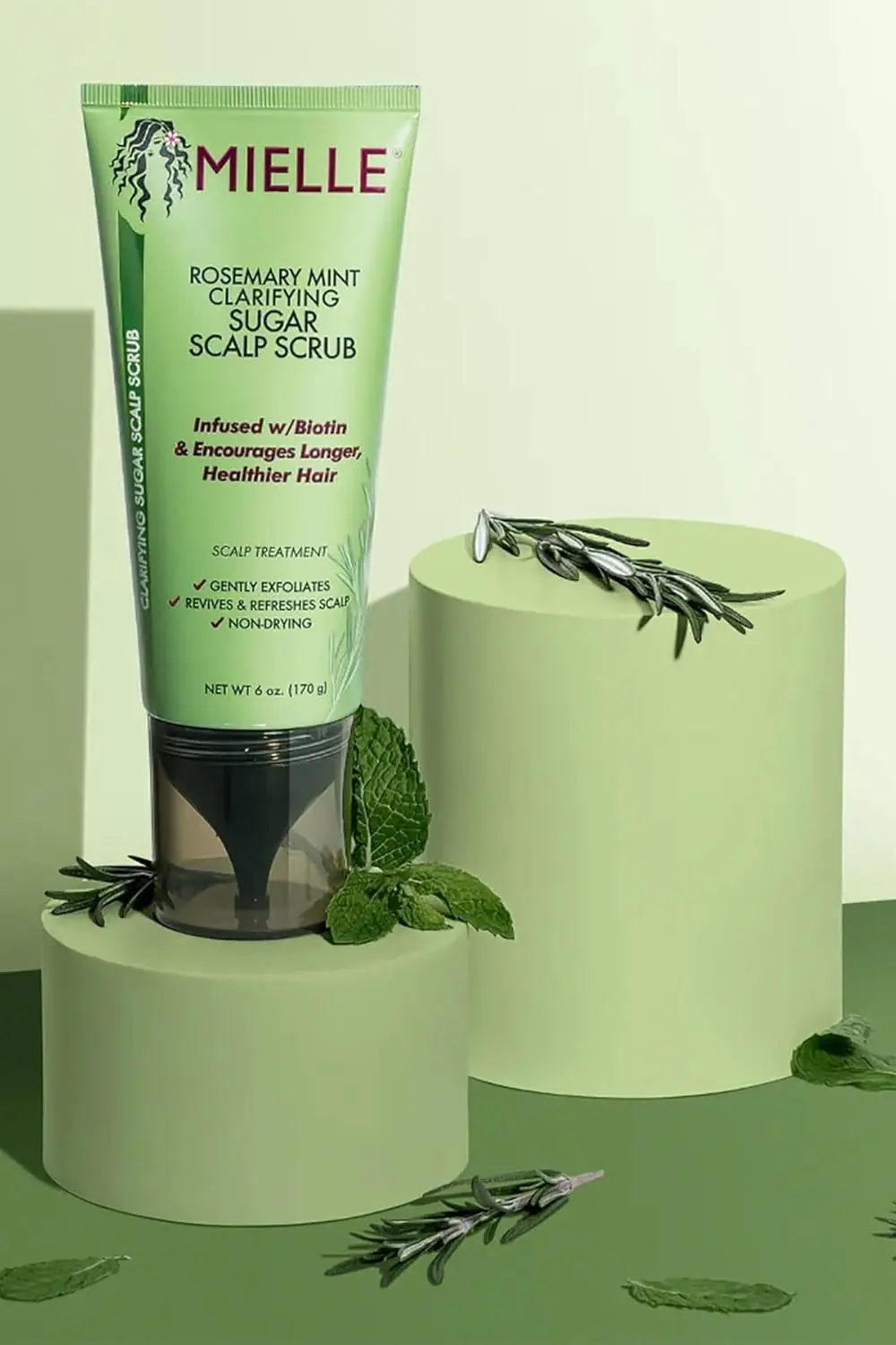 Mielle Rosemary Mint scalp scrub pre-shampoo treatment exfoliates to remove buildup and oil, leaving the scalp refreshed.