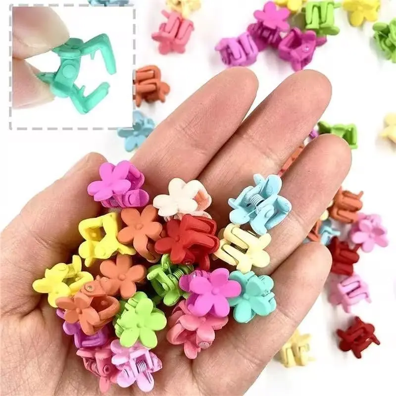 This set of 40 colorful mini flower hair clips are made of resin, perfect for creating stylish hairstyles for baby girls, toddlers, and women with thin or fine hair.