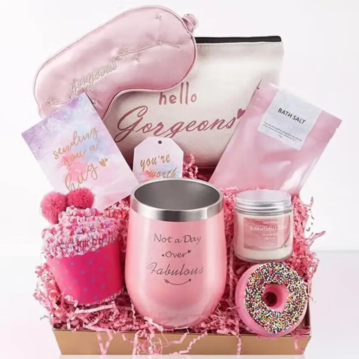 This MissTiara gift set for women features a tumbler, scented candle, bath bomb, socks, and other self-care items perfect for a relaxing spa day.