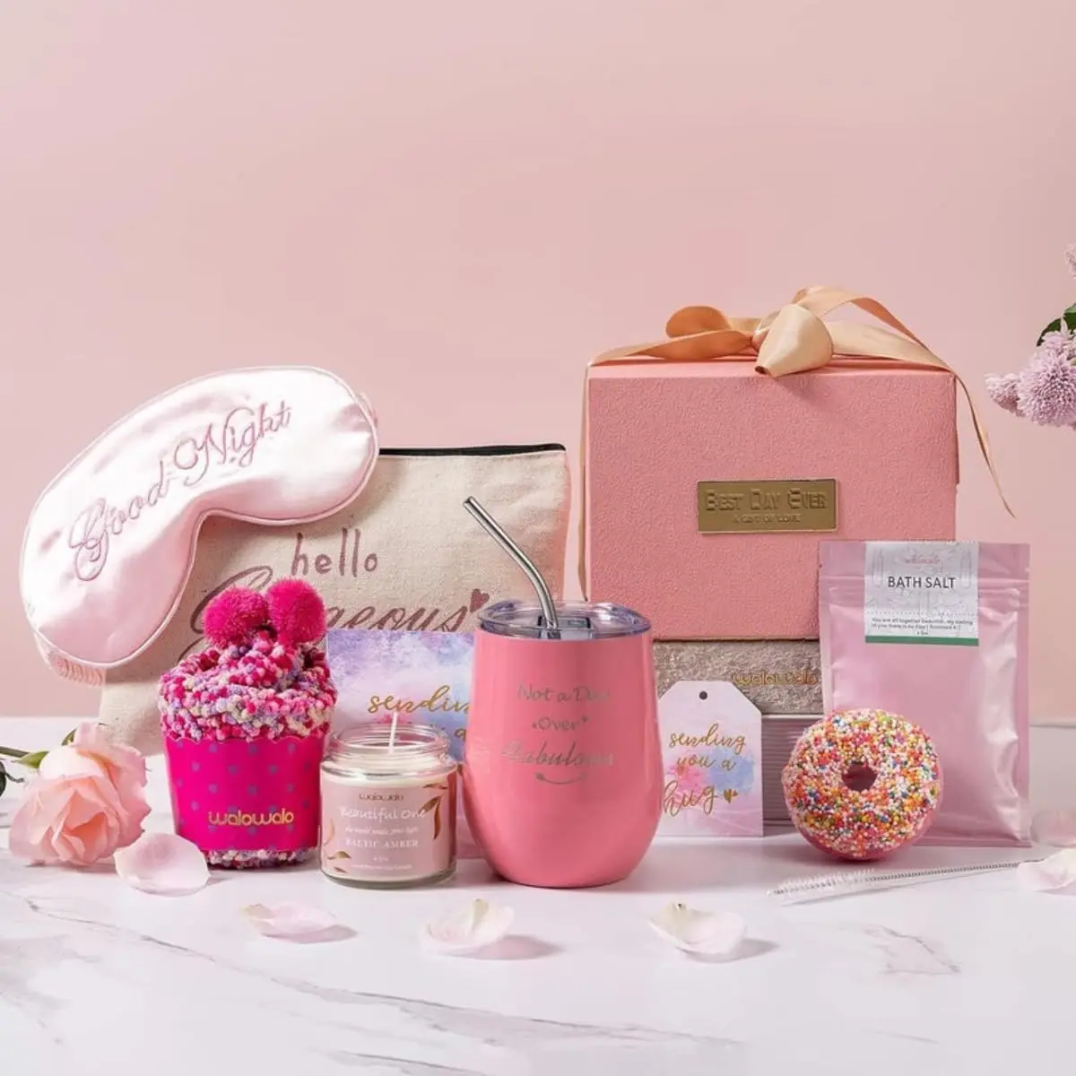This MissTiara gift set for women features a tumbler, scented candle, bath bomb, socks, and other self-care items perfect for a relaxing spa day.