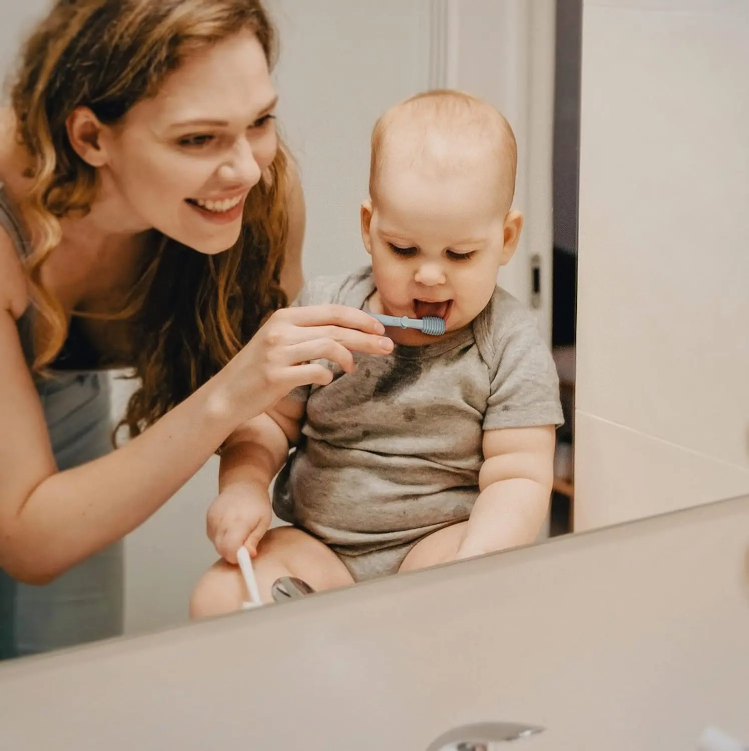 The Moonkie baby toothbrush set includes a silicone finger brush and tongue cleaner for gentle and effective oral care for babies 3 months and older.