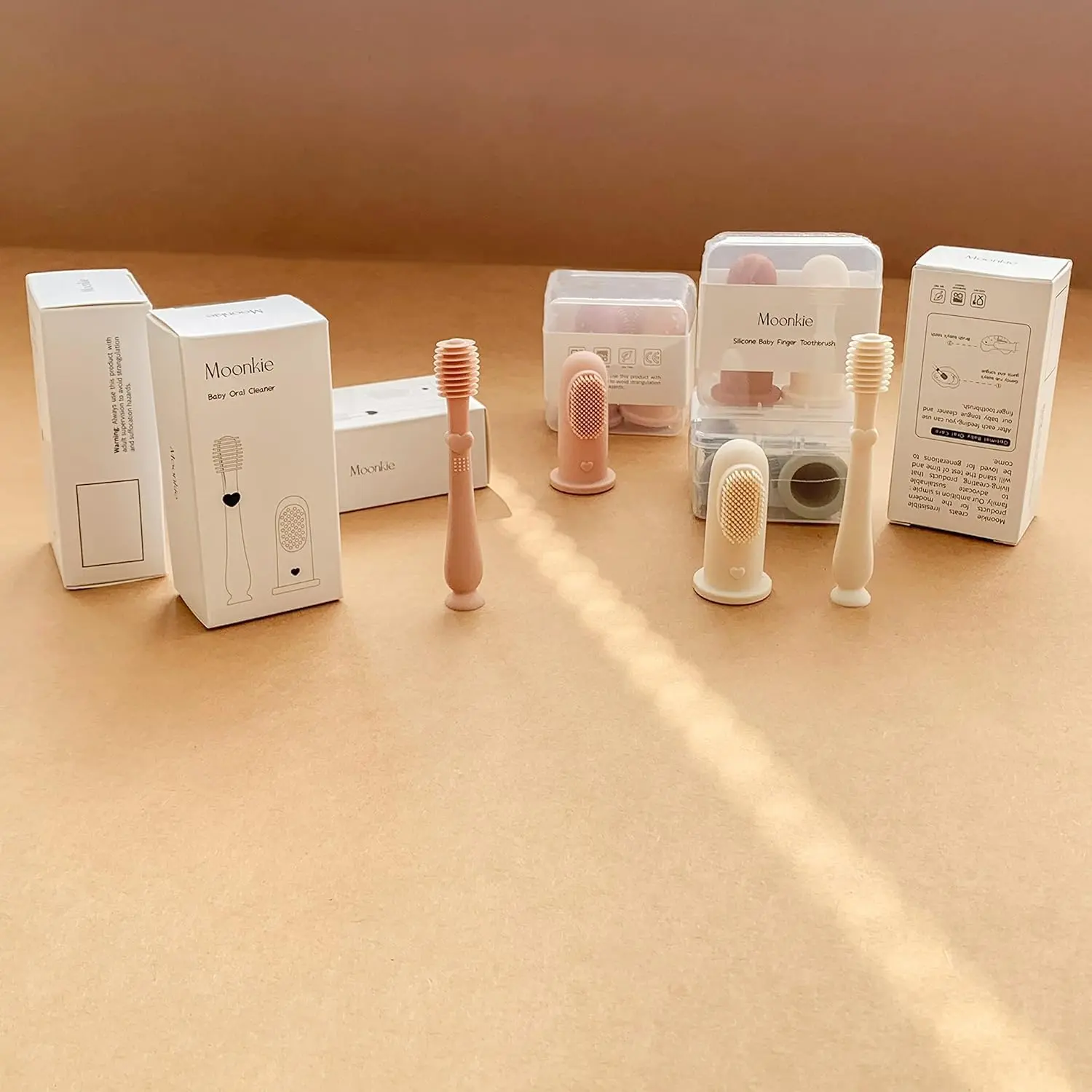 The Moonkie baby toothbrush set includes a silicone finger brush and tongue cleaner for gentle and effective oral care for babies 3 months and older.