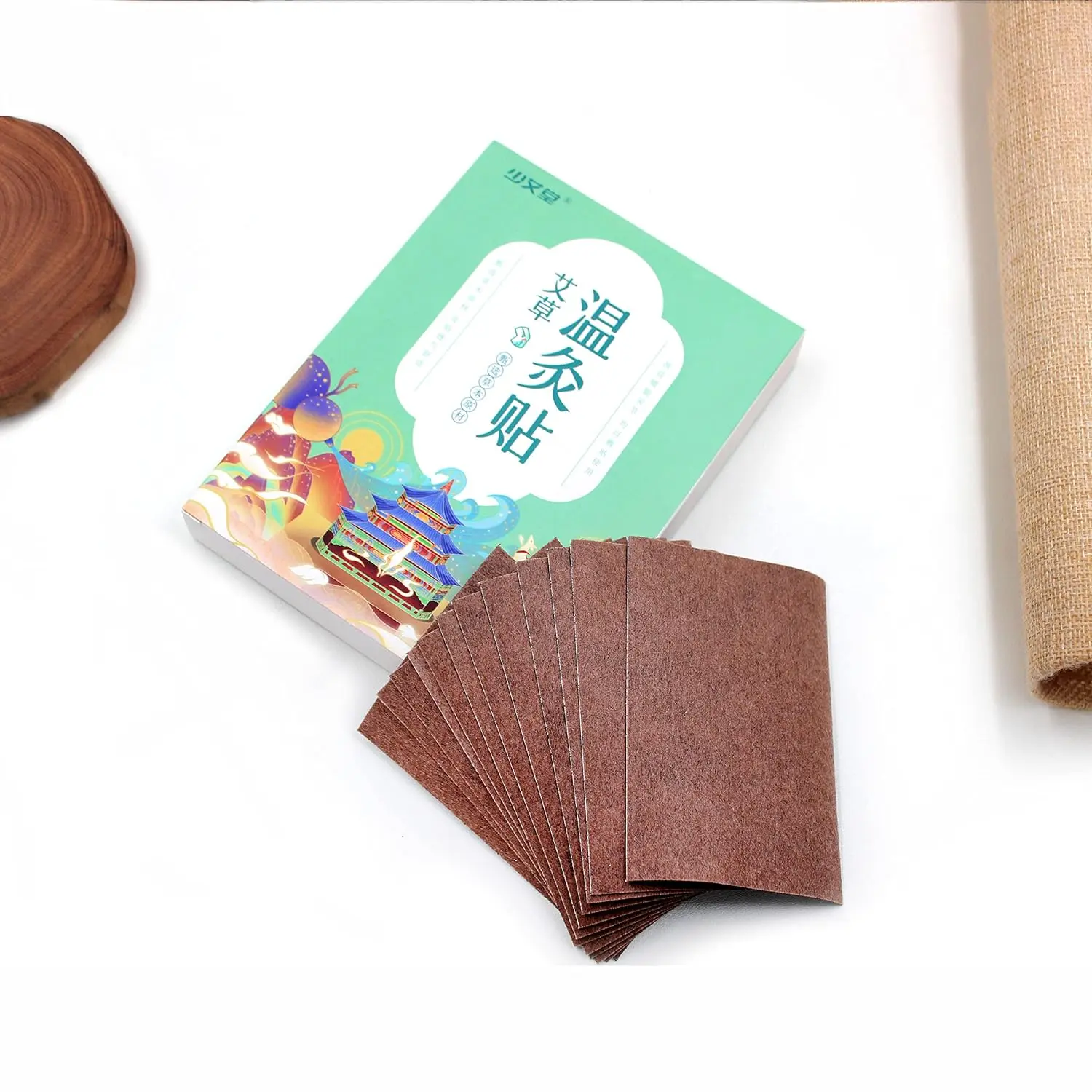 This moxibustion kit includes 54 high-purity moxa sticks and 12 wormwood moxa patches for traditional Chinese therapy to improve circulation and warm the body, along with an acupoint map.