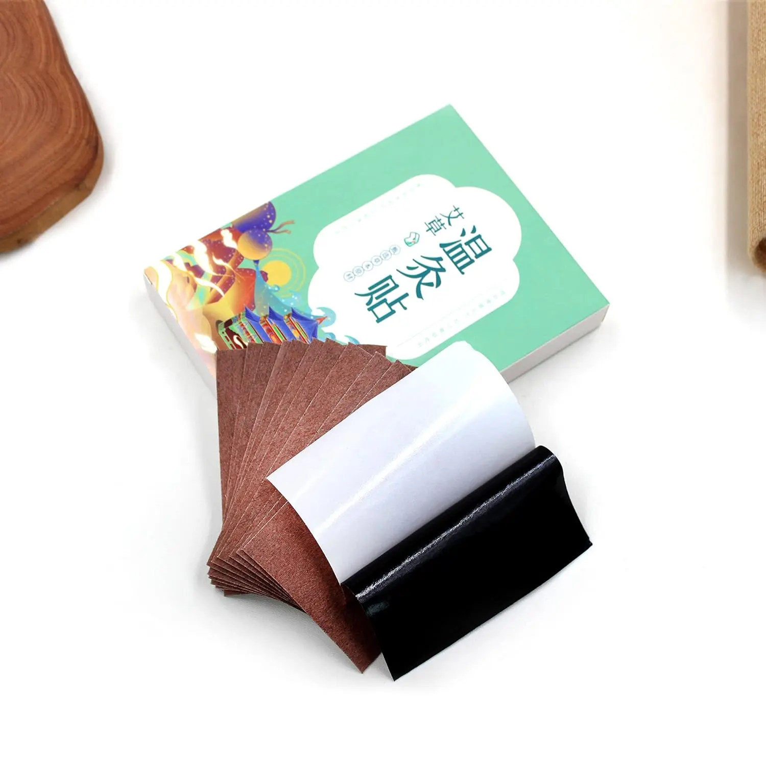 This moxibustion kit includes 54 high-purity moxa sticks and 12 wormwood moxa patches for traditional Chinese therapy to improve circulation and warm the body, along with an acupoint map.