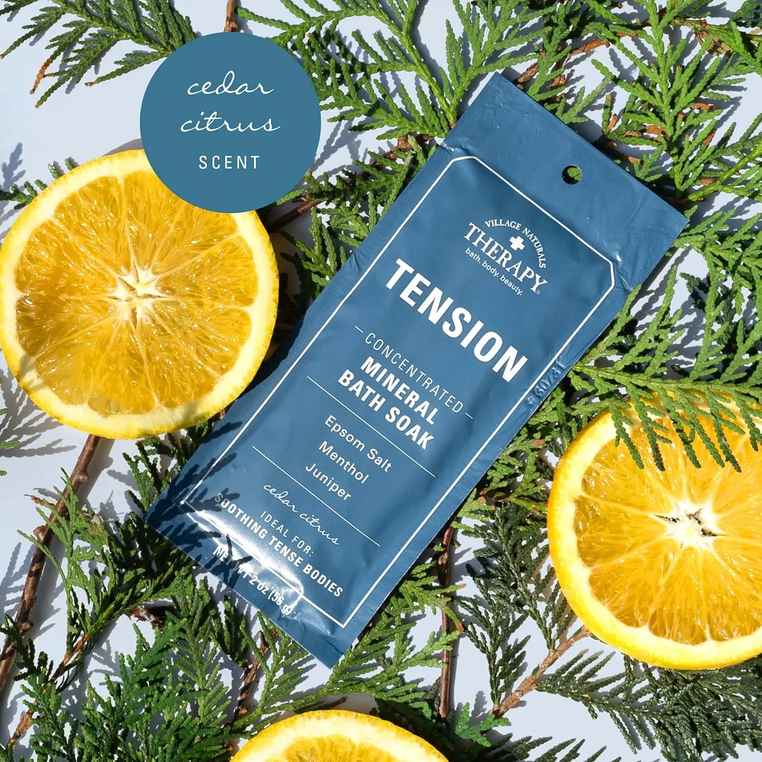 Twelve single-use packets of Village Naturals Therapy Aches & Pains Tension Relief Mineral Bath Soak with Juniper, Orange and Menthol, for on-the-go muscle relaxation.