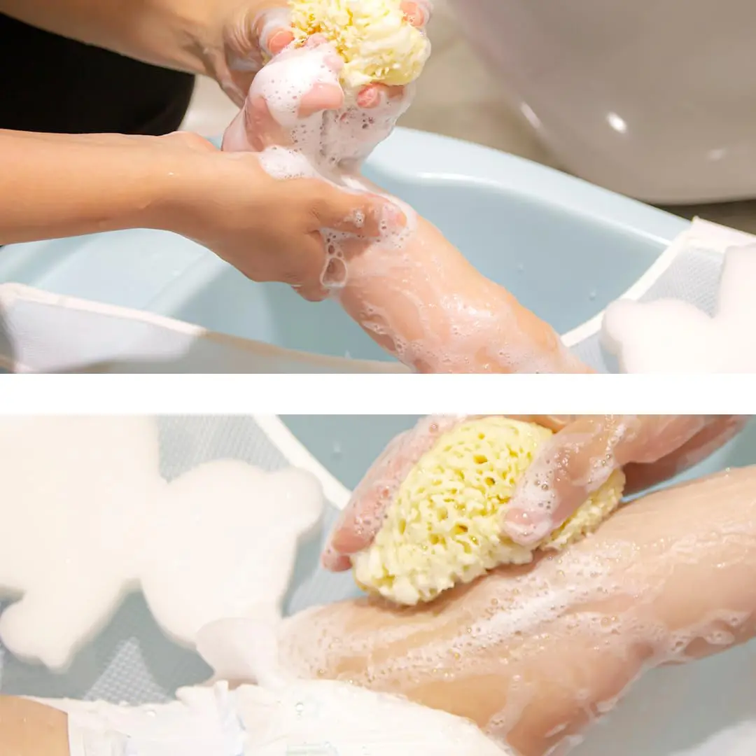 A soft, natural sea sponge perfect for gently cleansing delicate newborn skin during bath time, harvested from the Aegean Sea and suitable for sensitive skin.