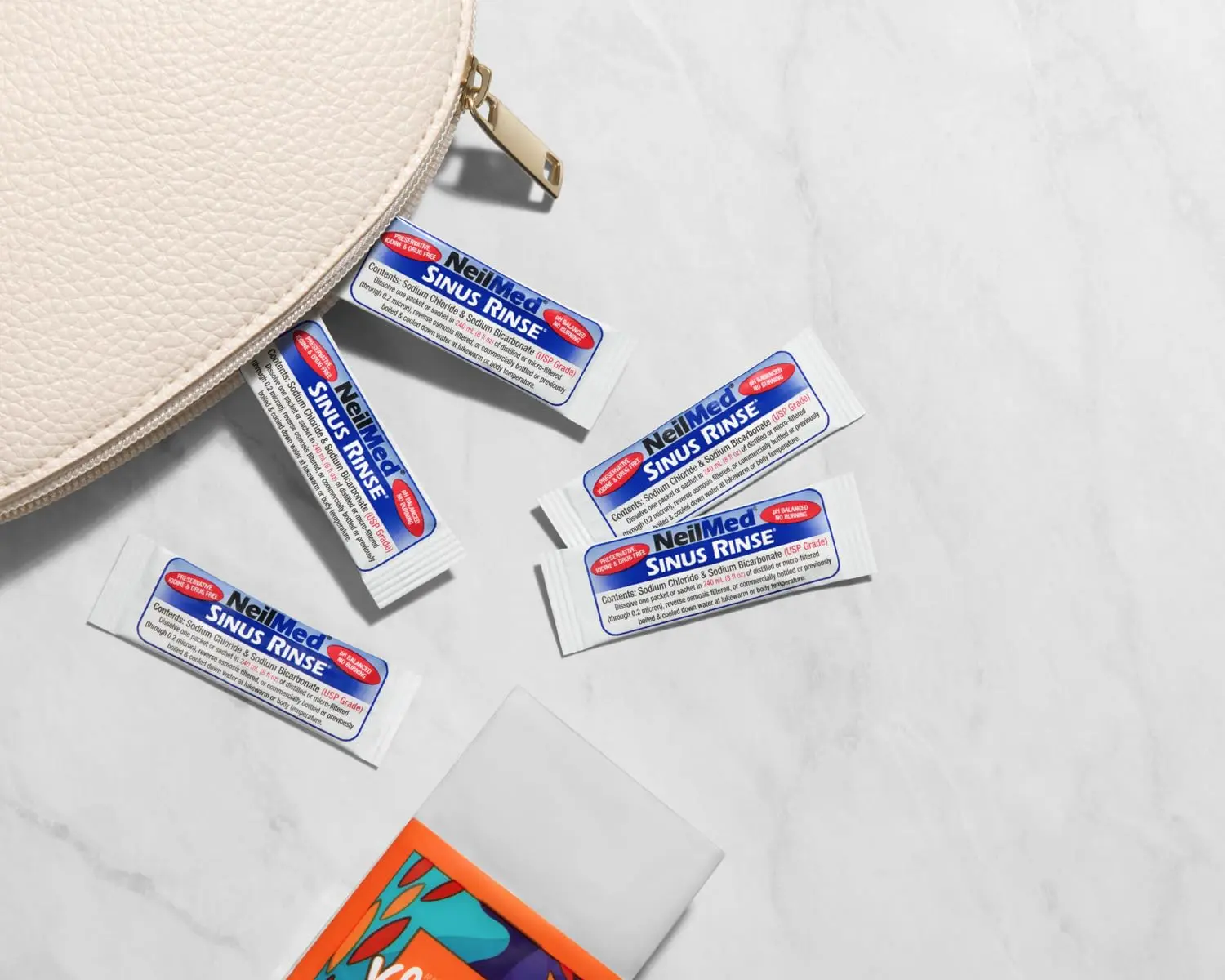 This image shows a box of NeilMed Sinus Rinse refill packets, providing all-natural relief for nasal allergies, congestion, dryness, sinus pressure, and irritation from dust, pollen, smoke, and pet dander.