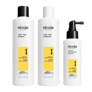 Nioxin System 1 kit includes shampoo, conditioner, and scalp treatment to strengthen hair, reduce breakage, and promote a healthy shine for natural hair experiencing light thinning.