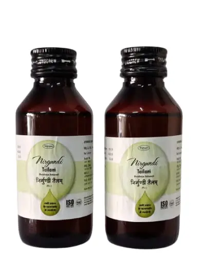 Three bottles of Nagarjun Nirgundi Tailam, an Ayurvedic oil indicated for vata disorders, sinusitis, and scrofula.