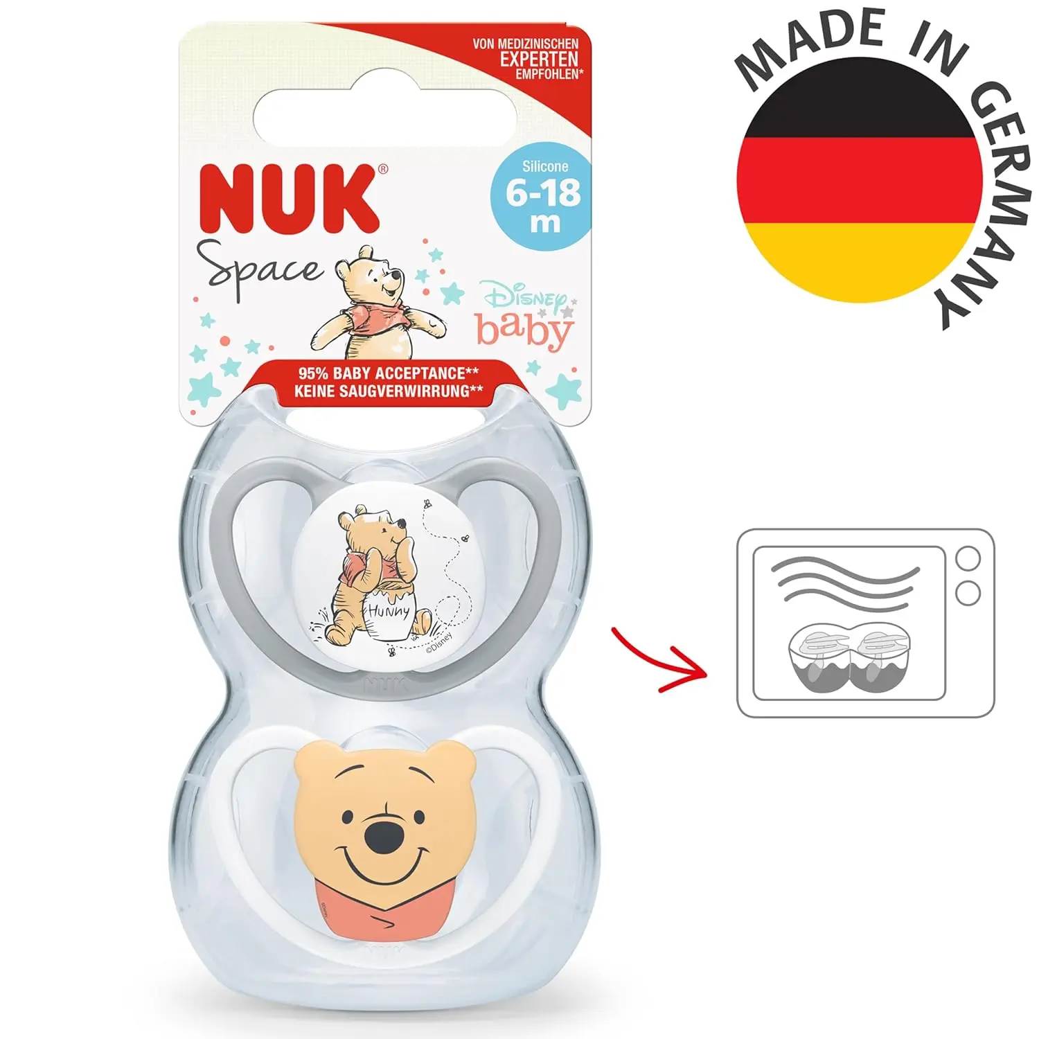 Two BPA-free NUK Space baby dummies featuring a Winnie the Pooh design, created with extra-large air openings for sensitive skin and promoting healthy oral development in babies aged 6-18 months.