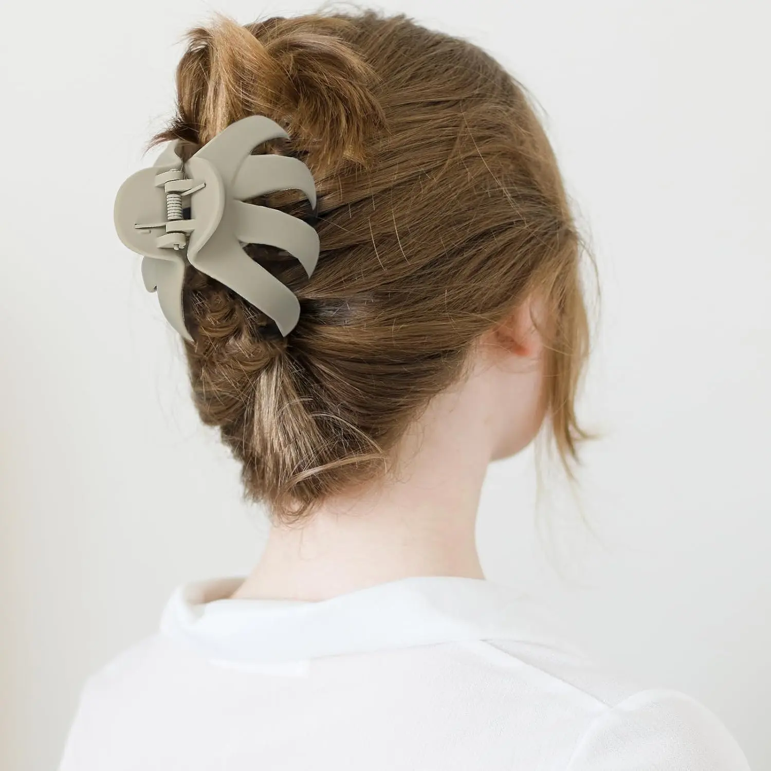 A set of five octopus-shaped hair claw clips in various colors, designed for securely holding thick and curly hair.