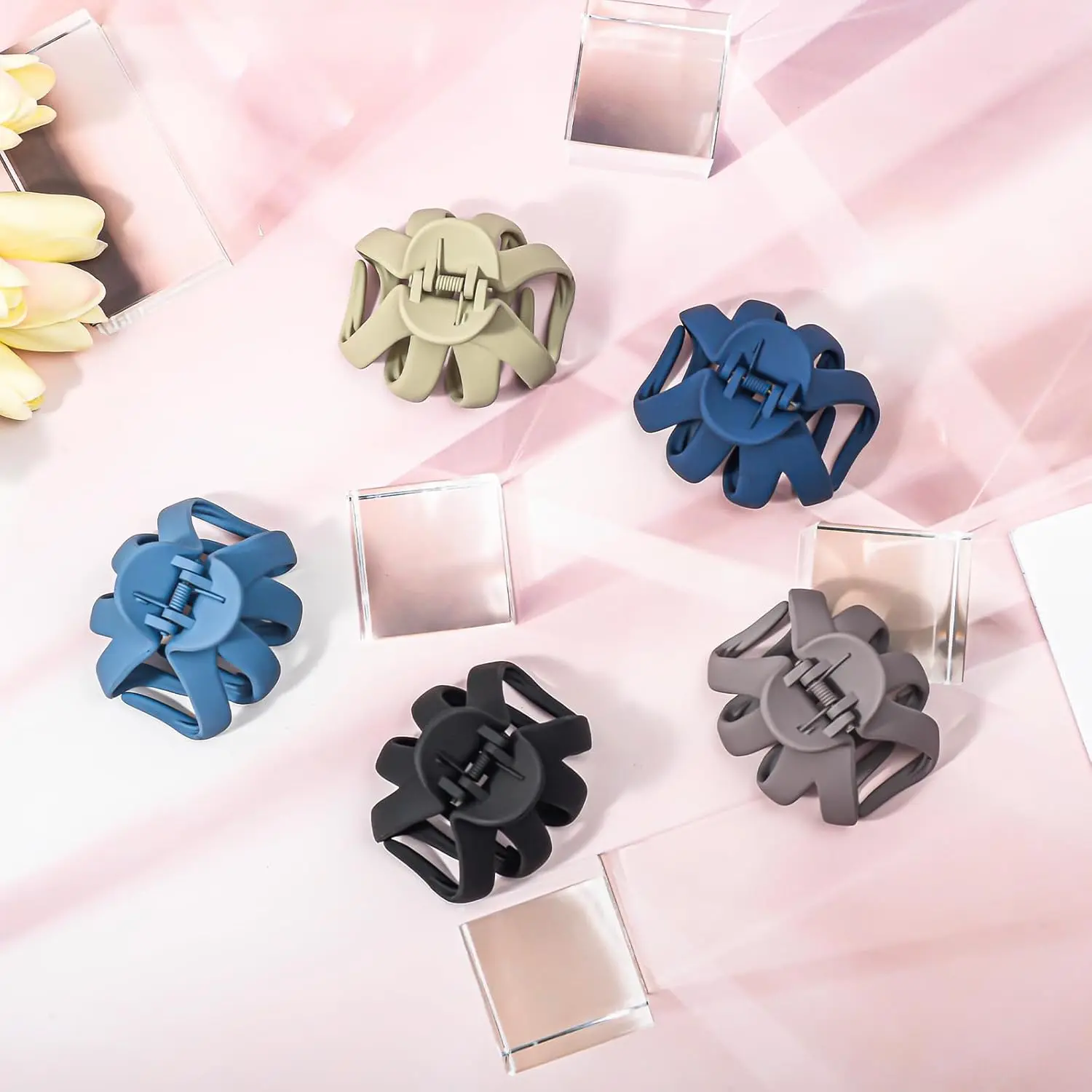 A set of five octopus-shaped hair claw clips in various colors, designed for securely holding thick and curly hair.
