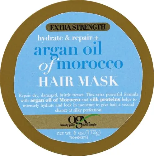 A 6-ounce container of OGX Extra Strength Argan Oil of Morocco hair mask provides deep hydration and repair for damaged and dry hair, leaving it silky smooth and radiant.