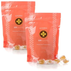 Two packs of DoTerra On Guard throat drops, individually wrapped with essential oils for soothing dry, scratchy throats and supporting the body's defenses.