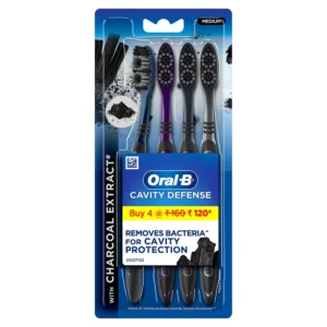 This image shows a pack of four Oral-B Cavity Defense toothbrushes with charcoal extract bristles, cup shaped design for deep cleaning, tongue cleaner, and hygienic head caps, that gently cleans enamel and gums.