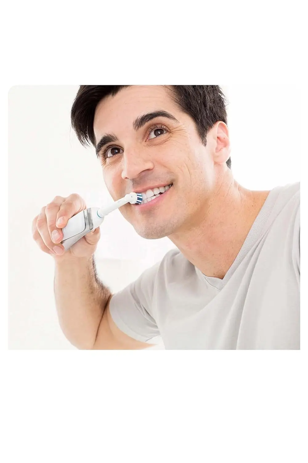 Four Oral-B Cross Action replacement brush heads angled to reach deep between teeth for superior plaque removal and healthier gums.