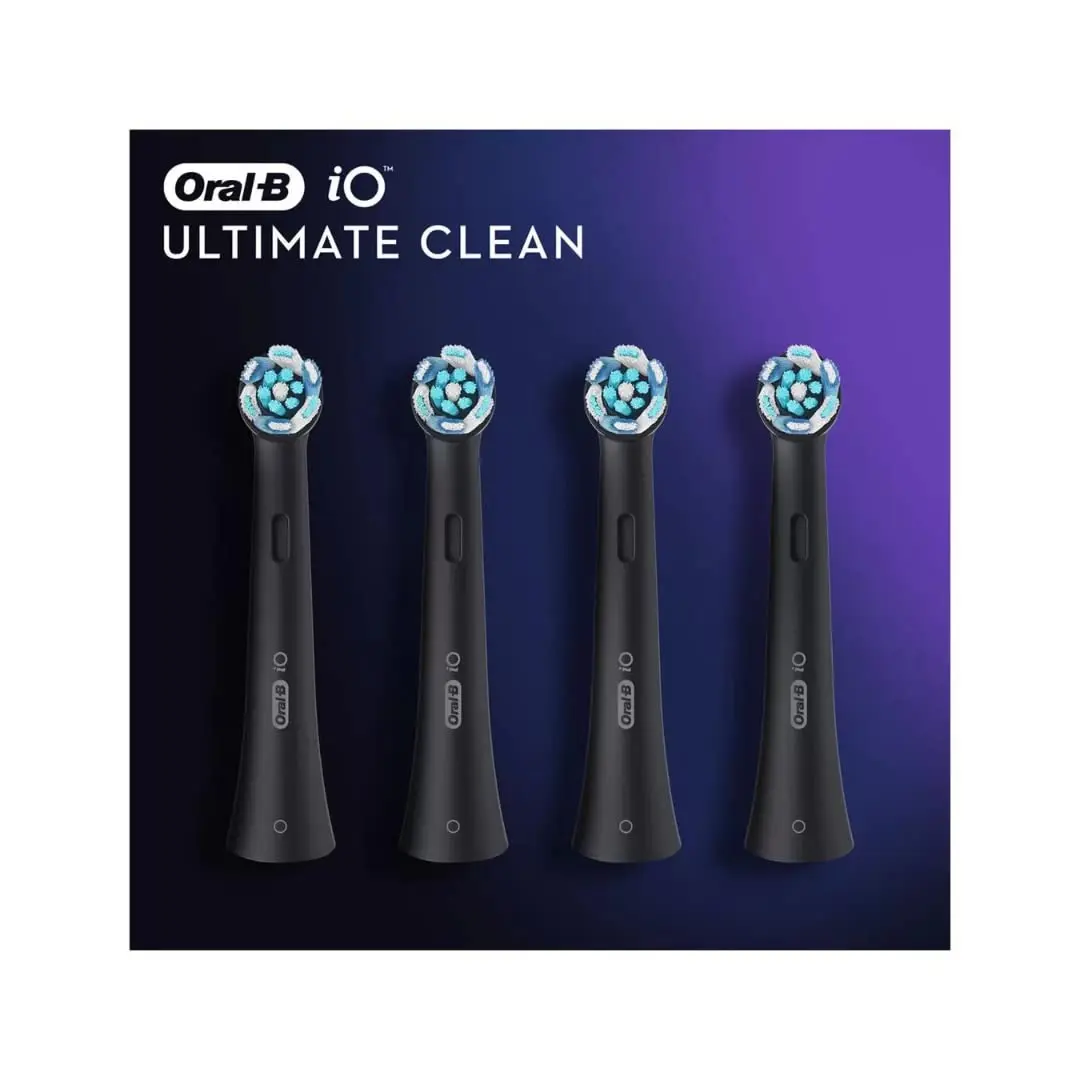A pack of four Oral-B iO Ultimate Clean black toothbrush heads, designed for up to 100% plaque removal and compatible with Oral-B iO electric toothbrushes, featuring innovative bristles and a dentist-recommended replacement schedule.