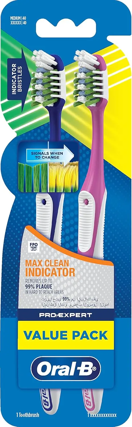 This image shows a 2-pack of Oral-B Pro-Expert Max Clean toothbrushes with CrissCross bristles that remove up to 99% of plaque in hard-to-reach areas, as recommended by dentists.
