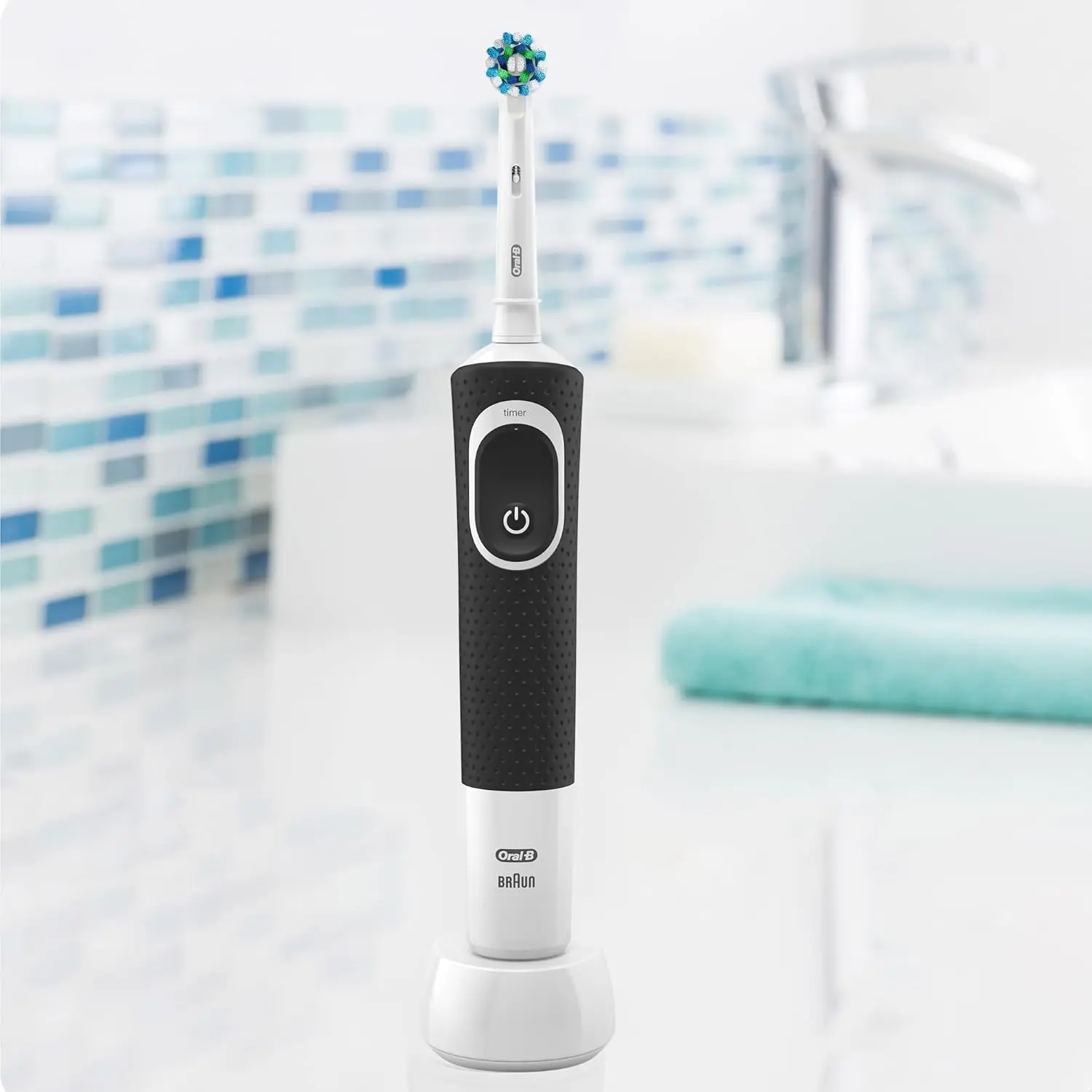 Black Oral B Vitality 300 rechargeable electric toothbrush with CrossAction brush head, offering 3 cleaning modes and a 2-minute timer for enhanced plaque removal and gum protection.