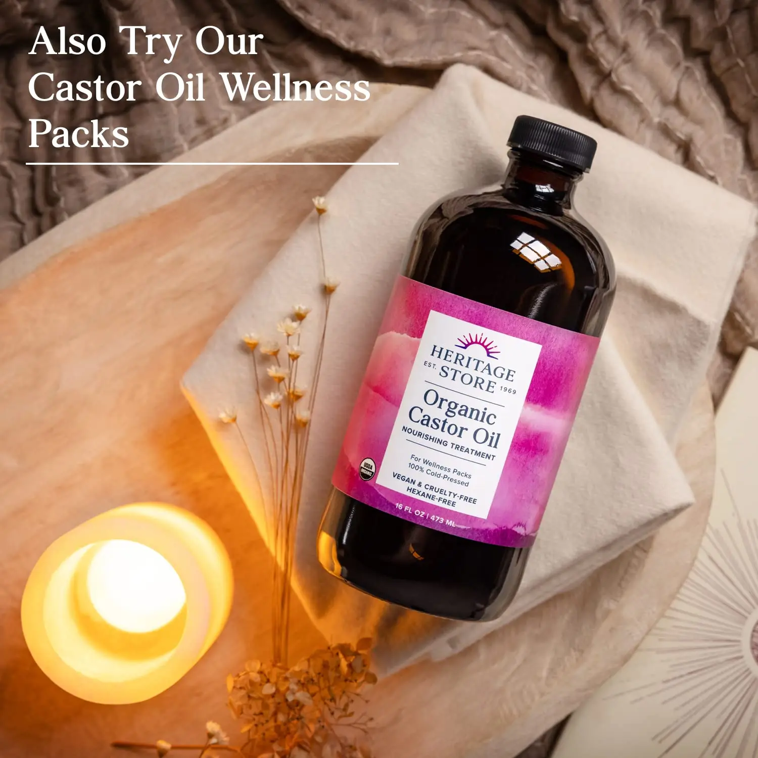 Heritage Store organic castor oil in a dark glass bottle, used for hair growth, eyebrow enhancement, and skin moisturizing, showcasing its pure and natural cold-pressed hexane-free formula.