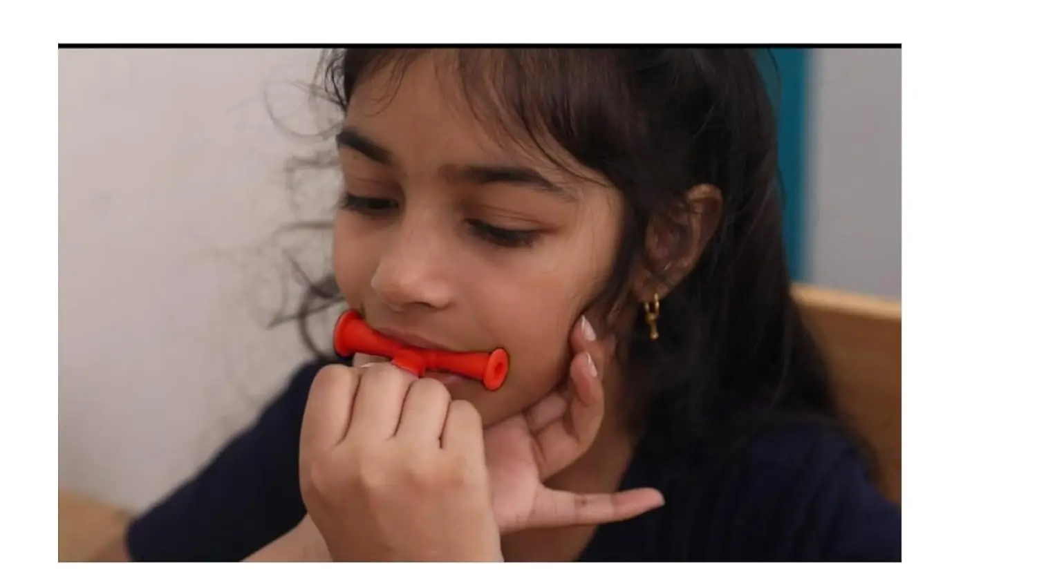 Red SPEECHGEARS Oro-Tube is a medical grade chewing tube designed for speech, feeding, and sensory integration, offering a resilient, non-consumable surface for jaw grading, alignment, and oral tactile treatment.