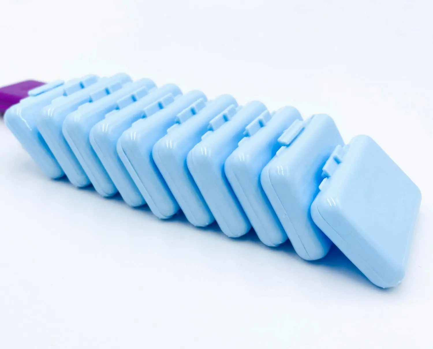 Ten boxes of clear orthodontic wax with mint scent offer temporary relief from braces irritation and gum protection.