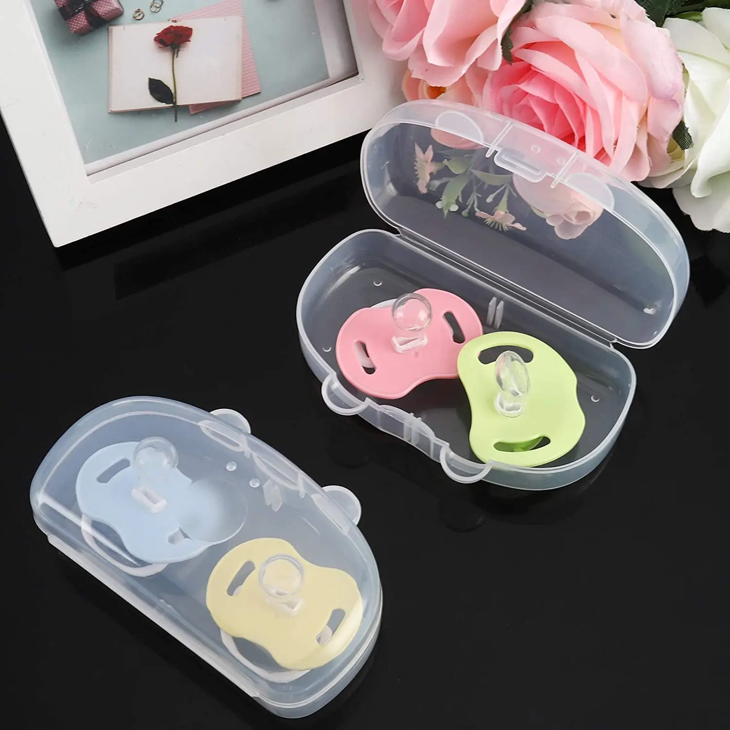 Clear BPA-free pacifier case holds two pacifiers, keeping baby's soothers clean and protected from dust during travel or at home.