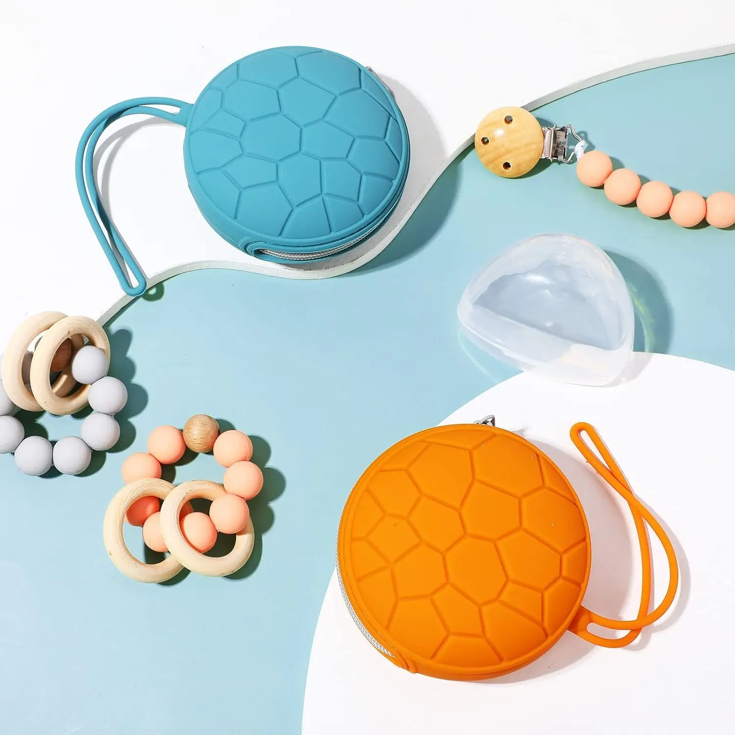 This pacifier holder case set includes two silicone pacifier holders and two transparent pacifier storage boxes to keep pacifiers clean and sanitary on the go.