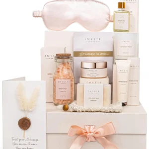 This luxury spa gift set is the perfect pamper gift for women who need self-care and relaxation, featuring a soy wax candle, body scrub, bath salts, and other premium essentials.