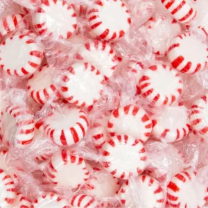 A two-pound bulk pack of red and white striped Starlight Peppermint Mints hard candy, individually wrapped and perfect for holiday treats.